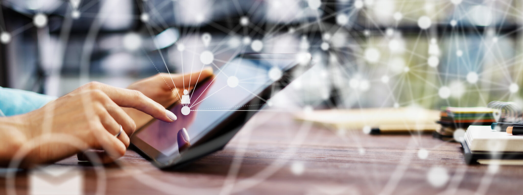 Close-up photo of female hands with digital tablet. Young woman working remotely at home. Concept of networking or remote work. Global business network. Online courses.