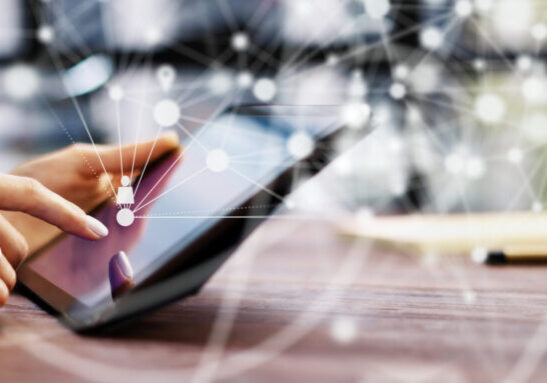 Close-up photo of female hands with digital tablet. Young woman working remotely at home. Concept of networking or remote work. Global business network. Online courses.